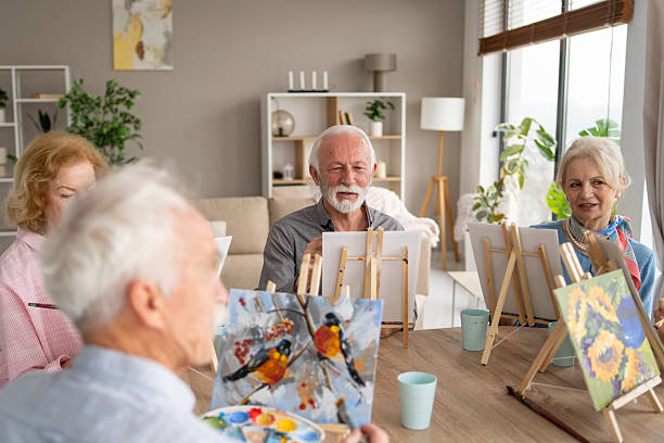 istock Seniors Enjoying a Painting Class Together in a Bright Room 2237014703