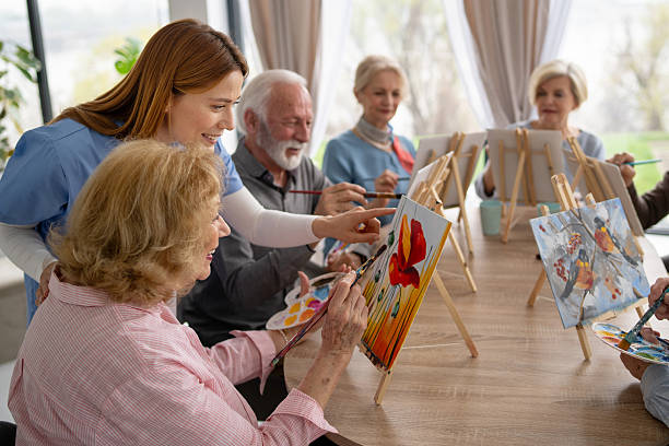 istock Seniors sharing creativity in a lively painting workshop 2237014708