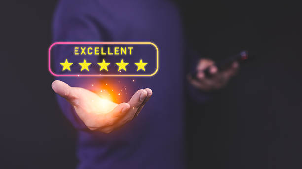 istock Male customer holding a glowing five star customer review, symbolizing high-quality service and positive customer satisfaction in online shopping, testimonial, and user experience evaluation. 2237016918