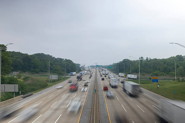 istock Busy Highway Under Overcast Sky With Blurred Traffic 2237019274