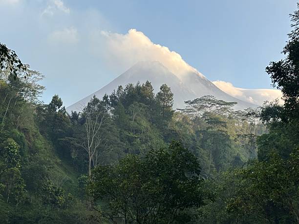 istock Volcano Peak Covered with Mist above Tropical Forest Valley 2237027912