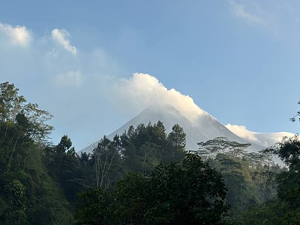 istock Volcano Peak Covered with Mist above Tropical Forest Valley 2237027998