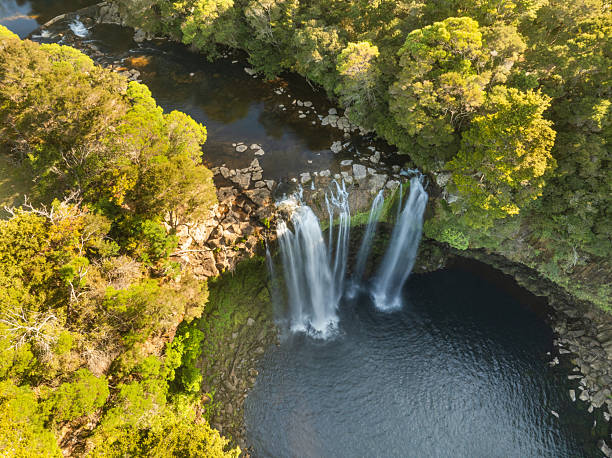 istock Kerikeri falls aerial shot surrounded by lush native bush. 2237030140