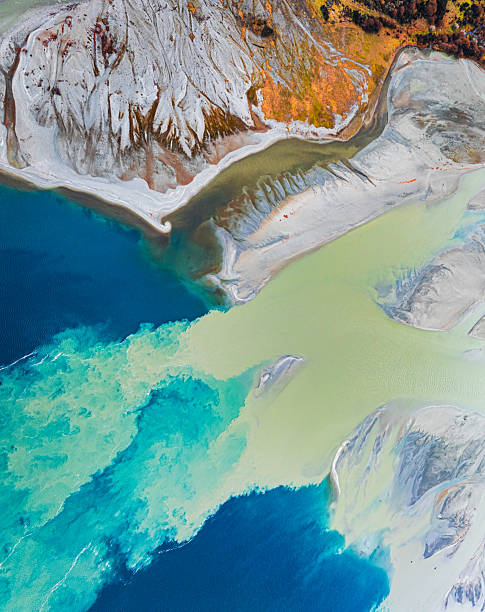istock Nature’s canvas, merging river and ocean flows seen from above. 2237030148