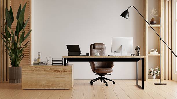 istock A stylish and modern home office interior with a comfortable leather chair, a computer on the desk, and a large plant, creating a productive workspace- 3D rendering 2237030951