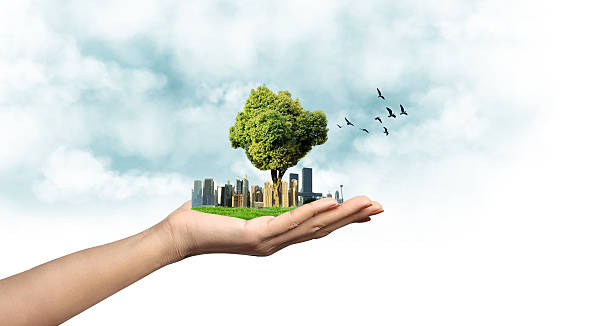 Hand holding modern Green city creative concept.