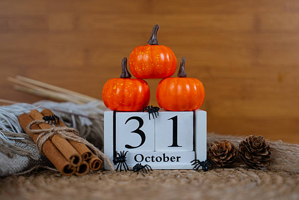 istock Stack of pumpkins with October 31 wooden block calendar 2237043165