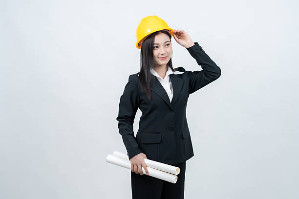 istock An Asian female engineer poses in a white background studio, holding a blueprint that conveys her leadership and influence across the global industry, blending elegance with knowledge. 2237043881