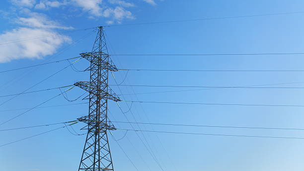 istock High Voltage Power Lines Stretching Against a Clear Blue Sky, Towering Above the Landscape 2237045739