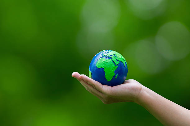 istock Human hand holding the Earth globe for the Sustainable Development Goals. Responsibility for the environment. Ecosystem. Save world. environmental protection, conservation, CSR, ESG, Earth Day. 2237047093
