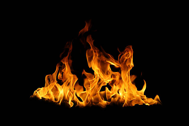 istock Realistic fire flames isolated on black background, burning effect with glowing orange heat. Perfect for overlays, design, visual effects, danger concepts, or dramatic backgrounds. 2237047346