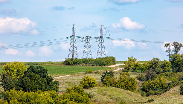 istock Three tall power lines are in the sky 2237048846