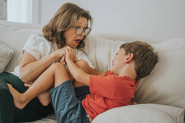 istock Woman playing with her grandson 2237050030