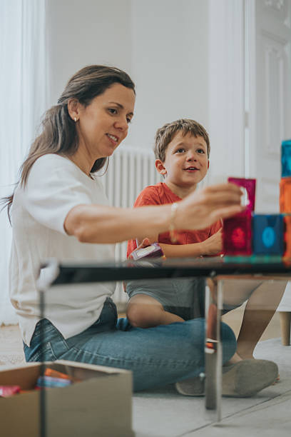 istock Mother and child playing with building blocks 2237050064