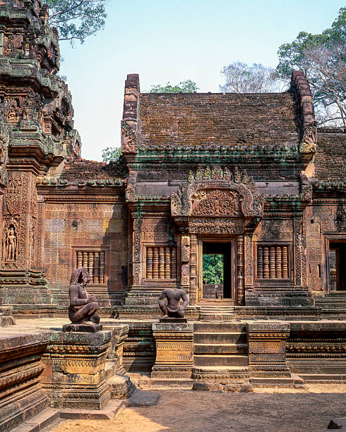Carved stone panel showcasing intricate Khmer art and mythology at Angkor Wat in Cambodia.