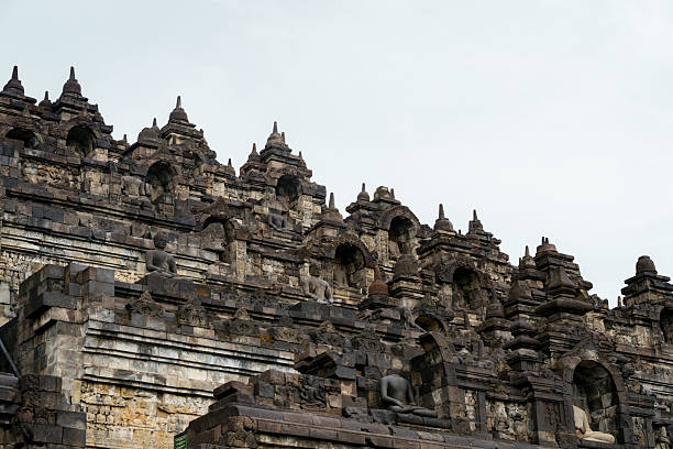 Ancient stone temple Borobudur architecture with intricate carvings and statues