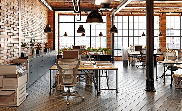 istock 3D rendering of a modern industrial loft office interior. Empty workspace with brick walls and wooden desks. Contemporary workplace design. 2237056558