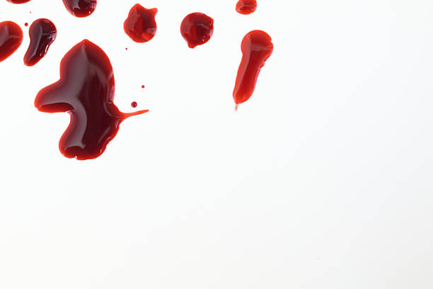 istock Droplets of blood spots on a white background. Top view with copy space 2237057291