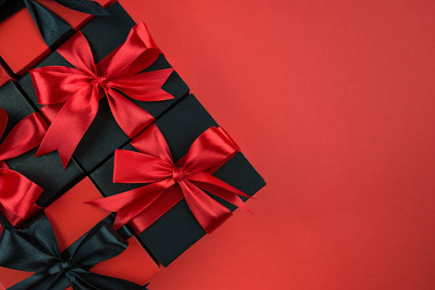 istock Top view photo of gift boxes with bow on isolated red background. 2237064163