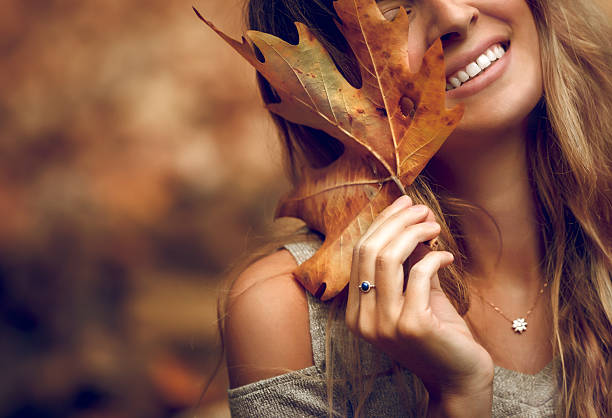 istock Pretty Girl in Autumn Park 2237066025