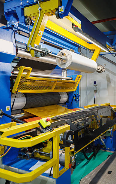 istock Industrial Printing Machine in a Bright Factory Setting With Yellow Safety Guards and Rollers 2237067014