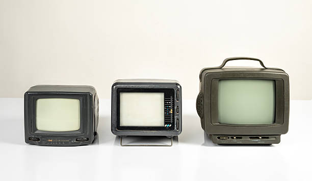 istock Three different vintage televisions with blank screens on a white background. 2237071034
