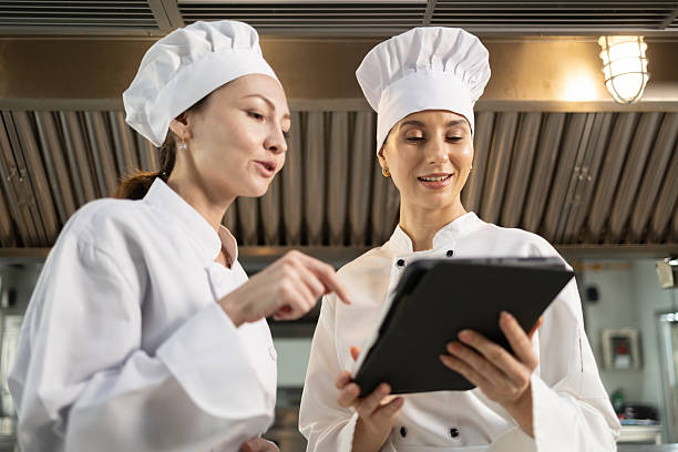 istock Woman Chef assisting a cooking class and explaining some tips and tricks 2237072408