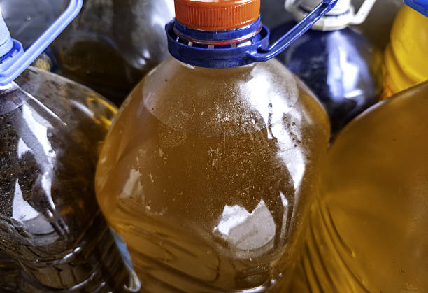 istock Bottles with used oil 2237072550