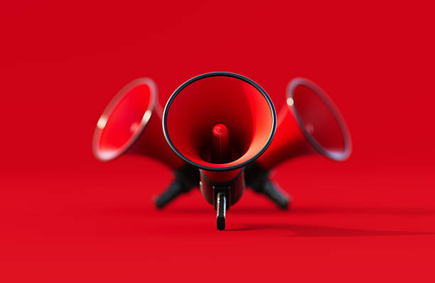 istock Black And Red Colored Megaphones On Red Background 2237072803