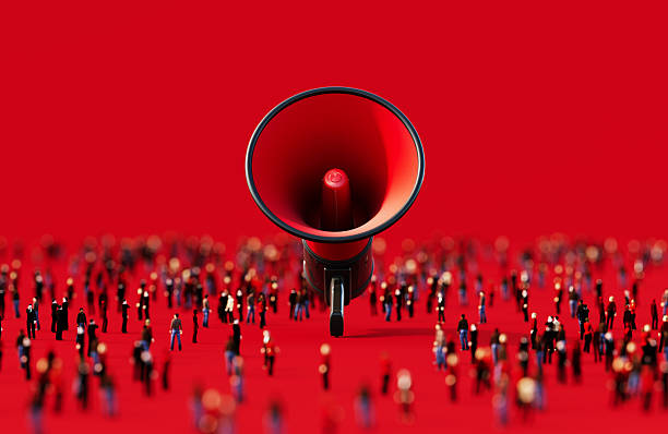 istock Black And Red Colored Megaphone Surrounded By Human Crowd On Red Background 2237072841