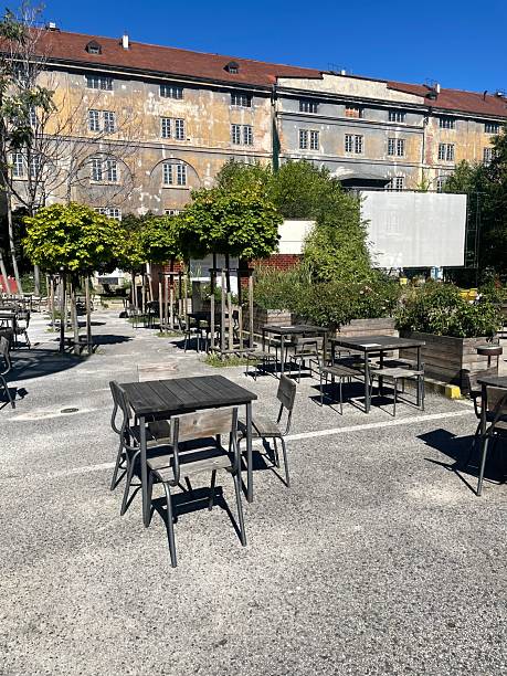 istock An inviting Outdoor Seating Area featuring Tables surrounded by Greenery 2237072979