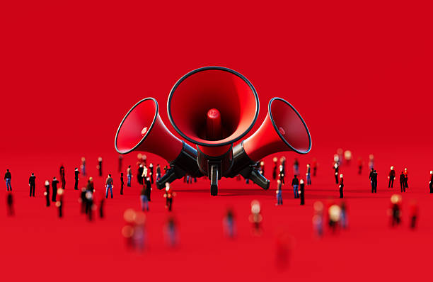 istock Black And Red Colored Megaphones Surrounded By Human Crowd On Red Background - Black Friday Concept 2237072980