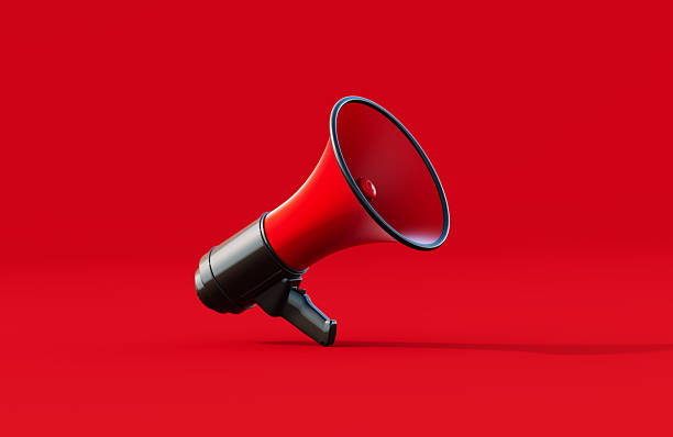 istock Black And Red Colored Megaphone Surrounded By Human Crowd On Red Background 2237073119