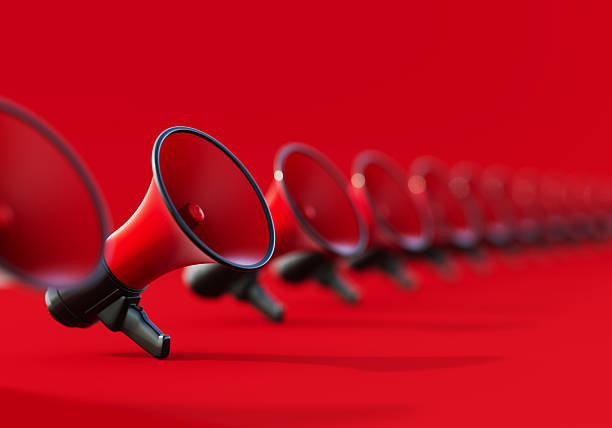 istock Black And Red Colored Megaphones On Red Background 2237073170