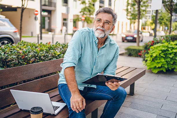 istock Business man working in the park 2237082436