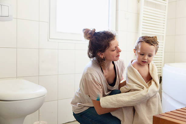 istock Mother drying toddler boy after bath 2237082556