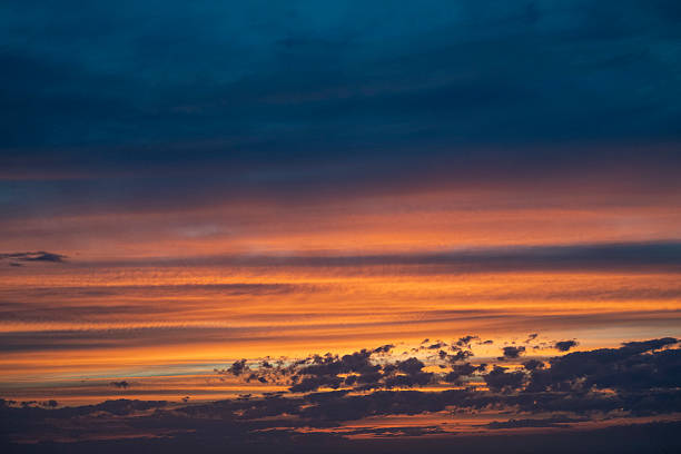 istock Sky transforms with vibrant hues during stunning sunrise over the horizon clouds 2237083631
