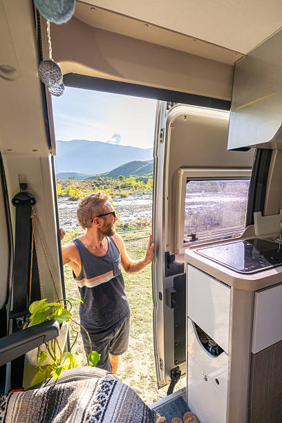 istock Man enjoying the van life in summer 2237084595