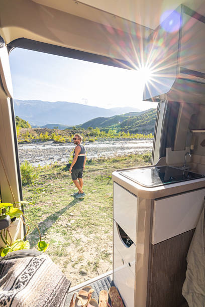 istock Man Enjoying Nature View from Camper Van 2237084894