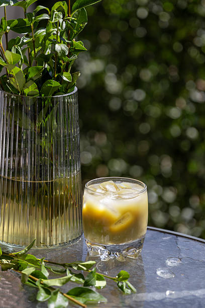 Refreshing Iced Matcha Latte on a Sunny Outdoor Table