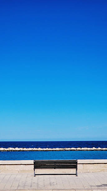 istock Empty Bench on the Bari Seafront with View of the Blue Sea 2237086666