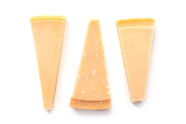Parmesan cheese wedges, overhead flat lay shot, isolated on a white background, an assortment