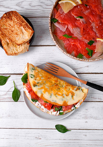 Crepe with salted trout fish and cream cheese on white table