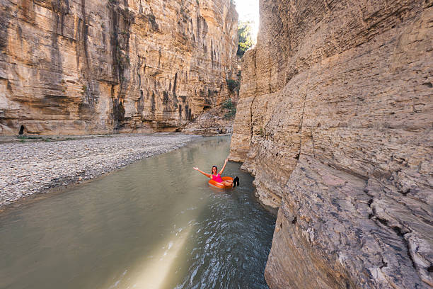 istock Person Floating on River in Rocky Canyon 2237087002