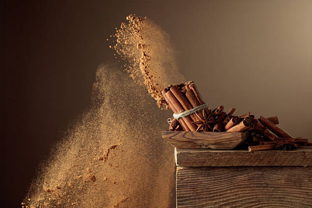istock Cinnamon sticks and powder on a brown background. 2237087063