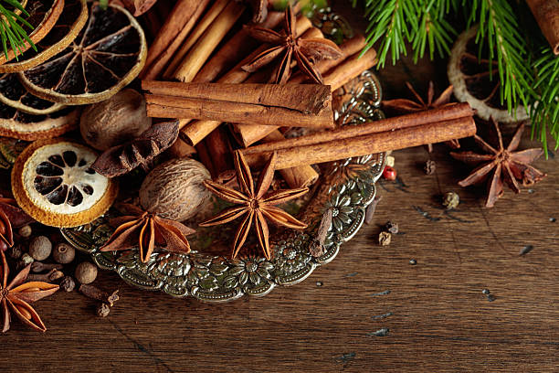 istock Various Christmas spices with dried citrus slices on silver tray. 2237087072