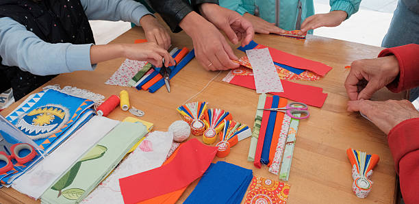 istock The hands crafting traditional textile dolls with colorful fabric strips 2237088122