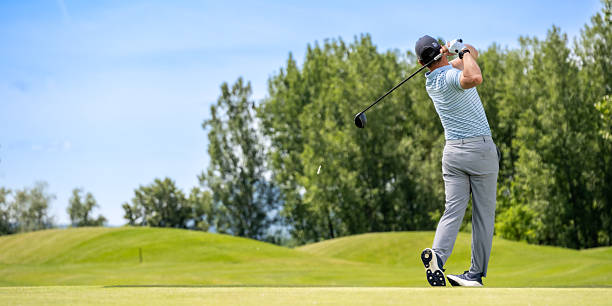 istock Medium Shot of Golfer Capturing Power in Motion on Green Course 2237090160