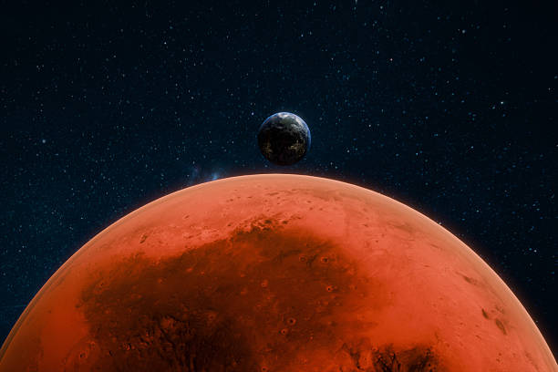istock Earth and Mars seen together in outer space, highlighting the contrast between the blue planet and the red planet against a starry background. red Martian surface. Space view of planet Earth from Mars 2237090355