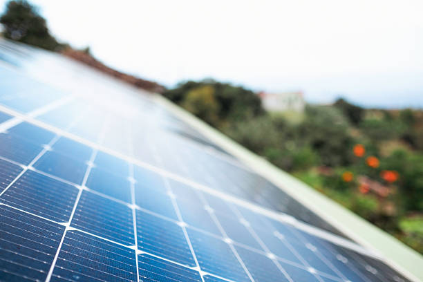 istock Photovoltaic solar panel generating renewable green energy on a rooftop 2237090785